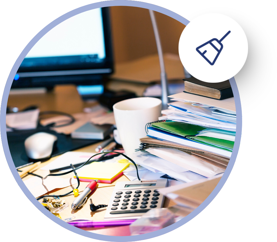 a broom icon hovering over a photo of a messy desk piled with books from a small business in need of bookkeeping cleanup and catch-up services in North Port, FL