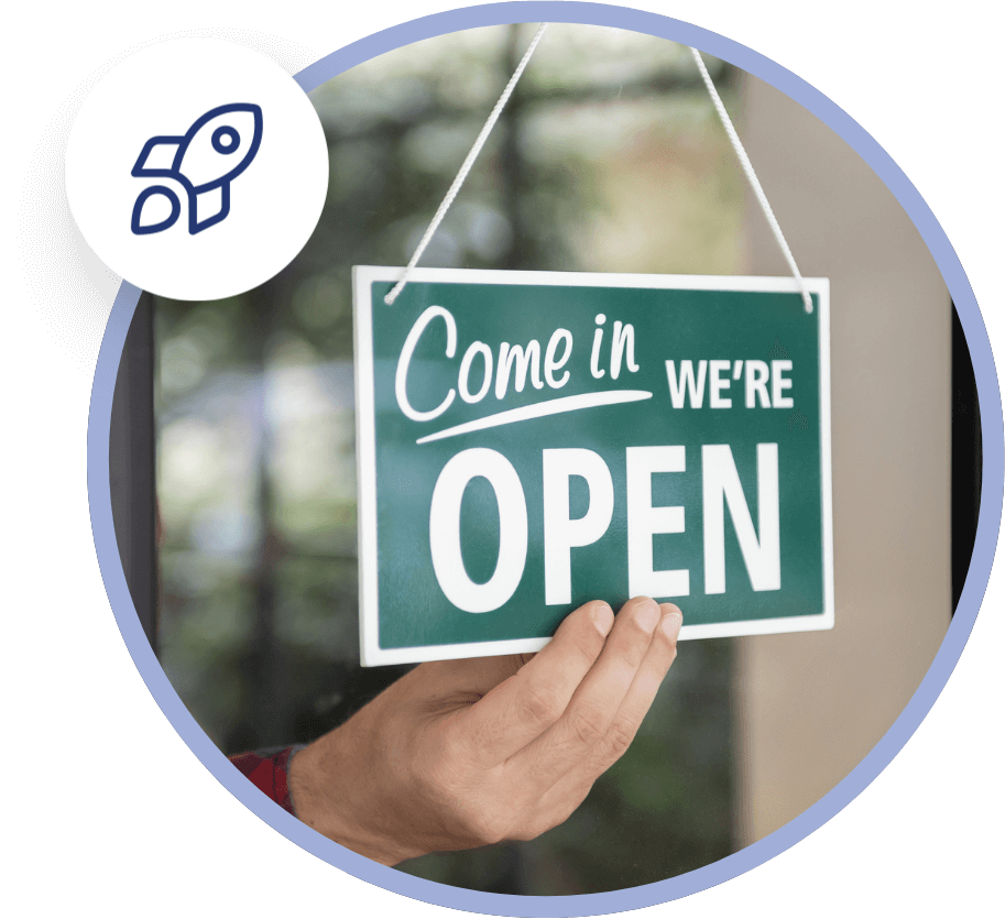 person hanging OPEN sign in the window after receiving help with their new business setup in North Port, FL
