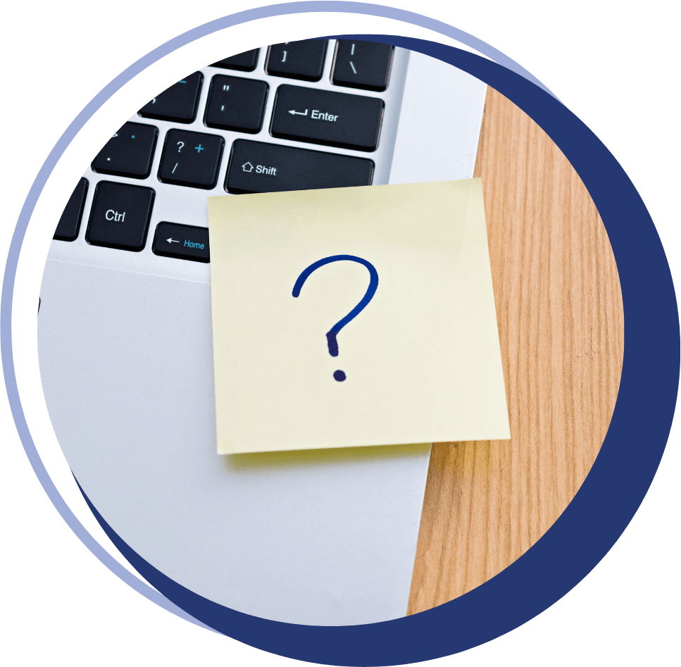 sticky note with a question mark drawn in blue marker, stuck to a laptop keyboard, indicating questions about accounting, bookkeeping, and taxes